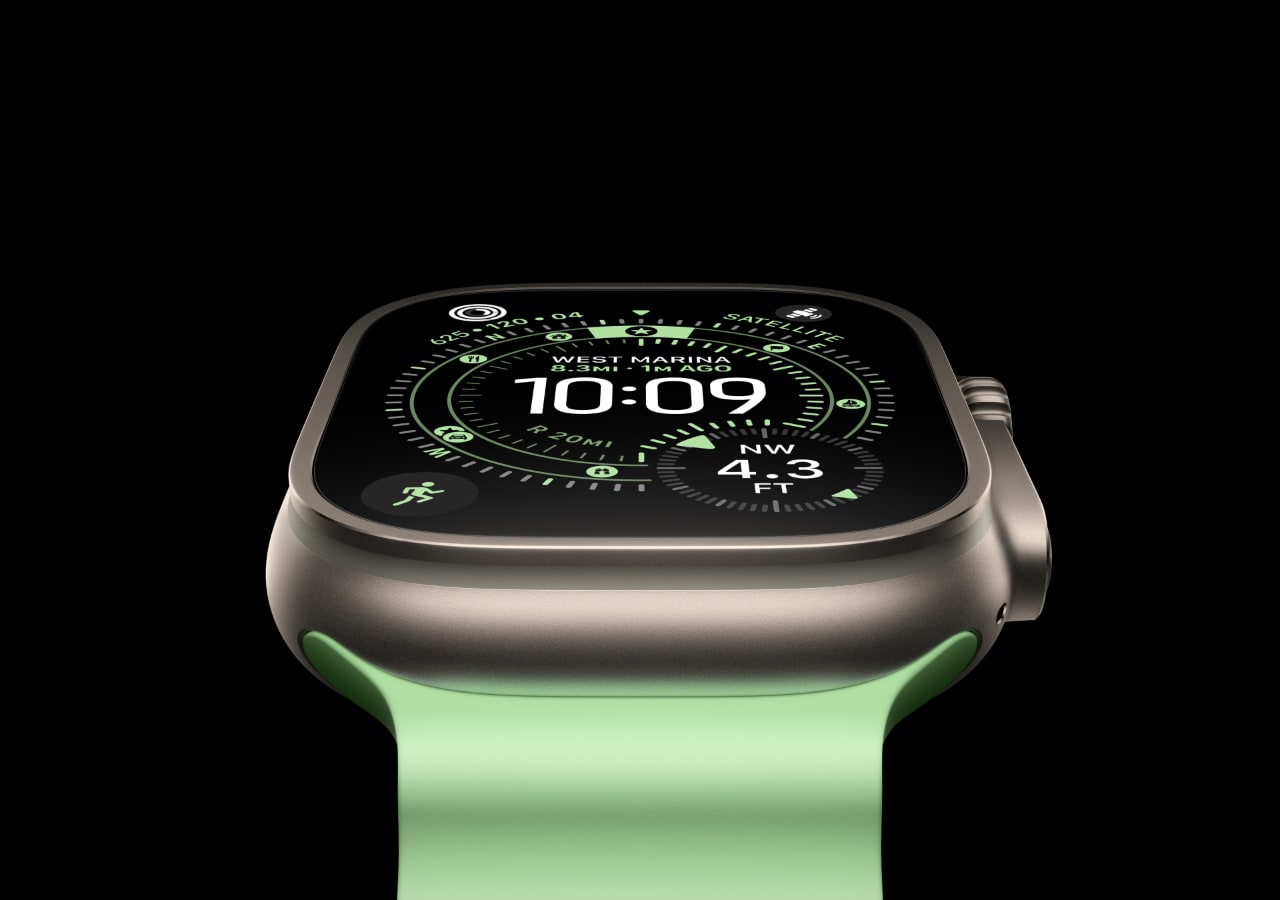 Montre intelligente avec écran numérique et bracelet vert.